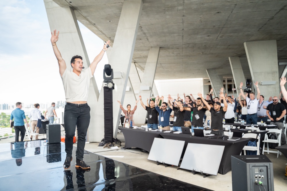 Ravi Abuvala on stage at the Scaling With Systems live event, 2022