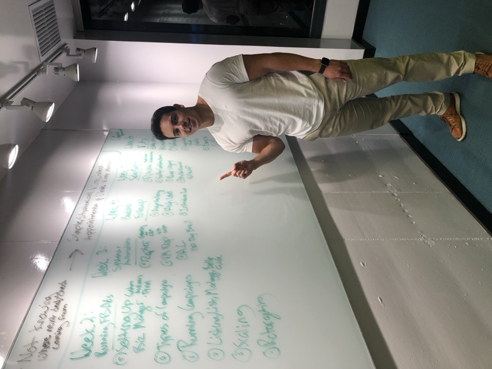 Ravi Abuvala mapping out Scaling With Systems on a whiteboard, 2019